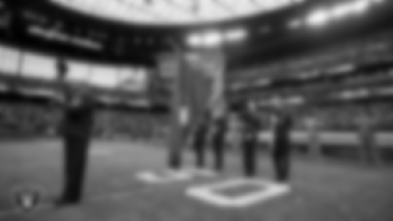 Retired Navy Petty Officer 1st Class, Generald Wilson, performs the national anthem, while the Nellis Air Force Base Color Guard presents the nation's colors, before the Las Vegas Raiders regular season home game against the Cincinnati Bengals.