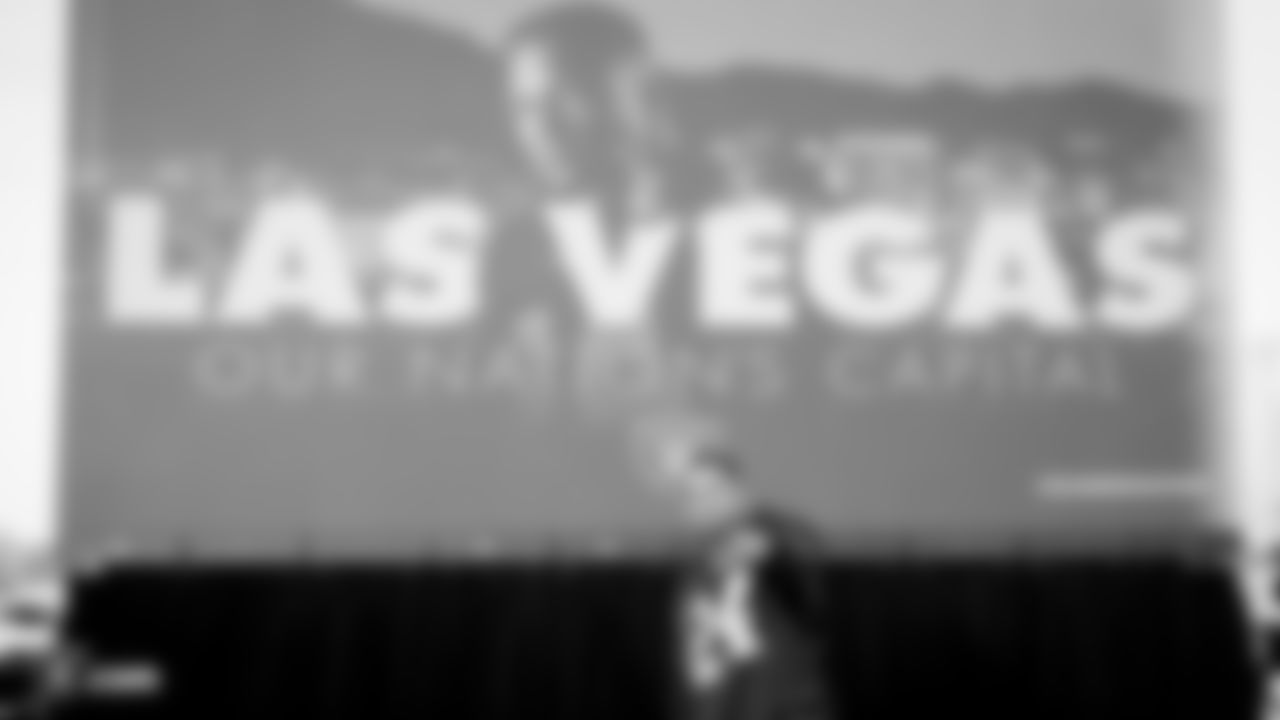 Raiders safety Johnathan Abram (24) stands in front of a Raiders sign, with his image on it, following an official announcement of the Raiders changing their name to the Las Vegas Raiders.