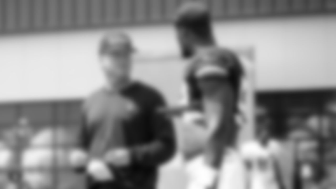 Oakland Raiders head coach Jon Gruden and linebacker Tahir Whitehead (59) on the field for a preseason practice at the Oakland Raiders Practice Facility, Monday, August 27, 2018, in Alameda, California.