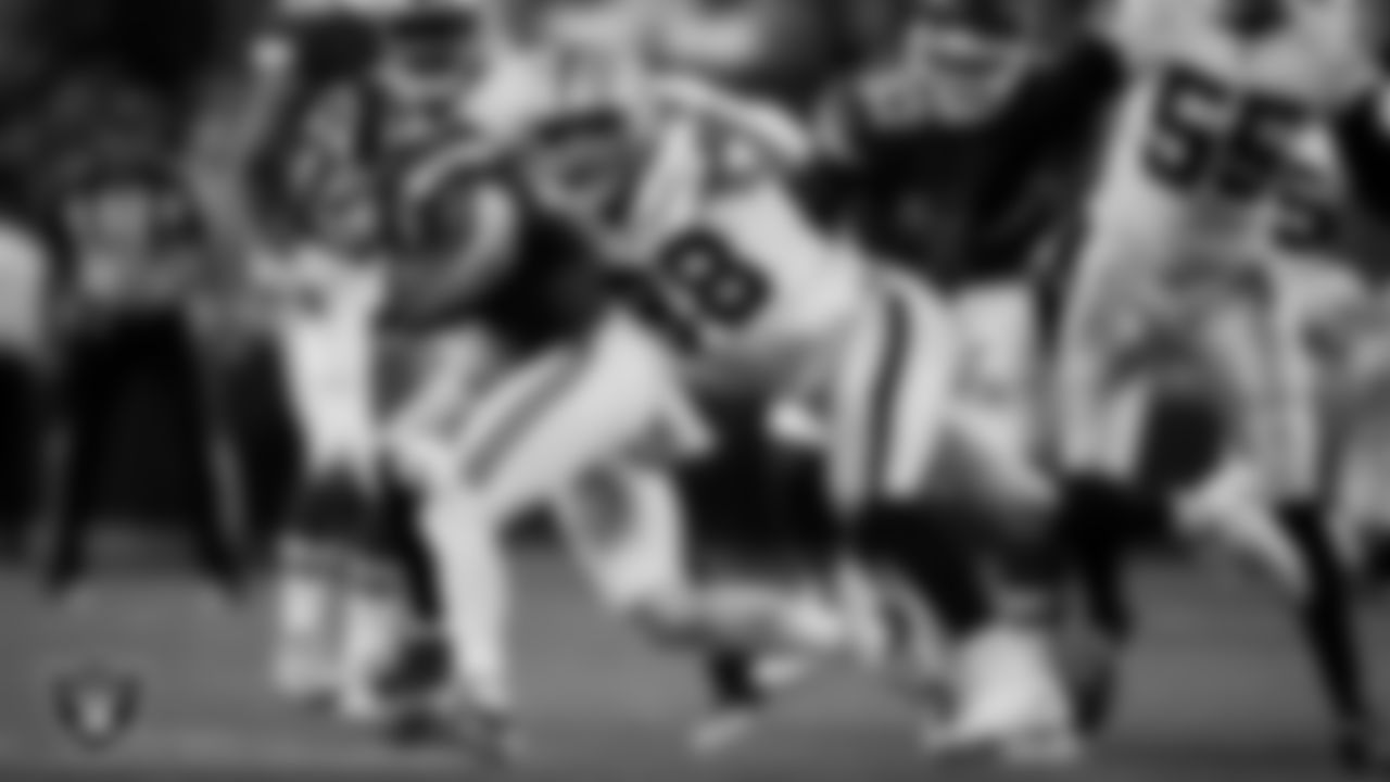 Las Vegas Raiders defensive end Maxx Crosby (98) makes a tackle during the regular season away game against the Kansas City Chiefs at GEHA Field at Arrowhead Stadium.