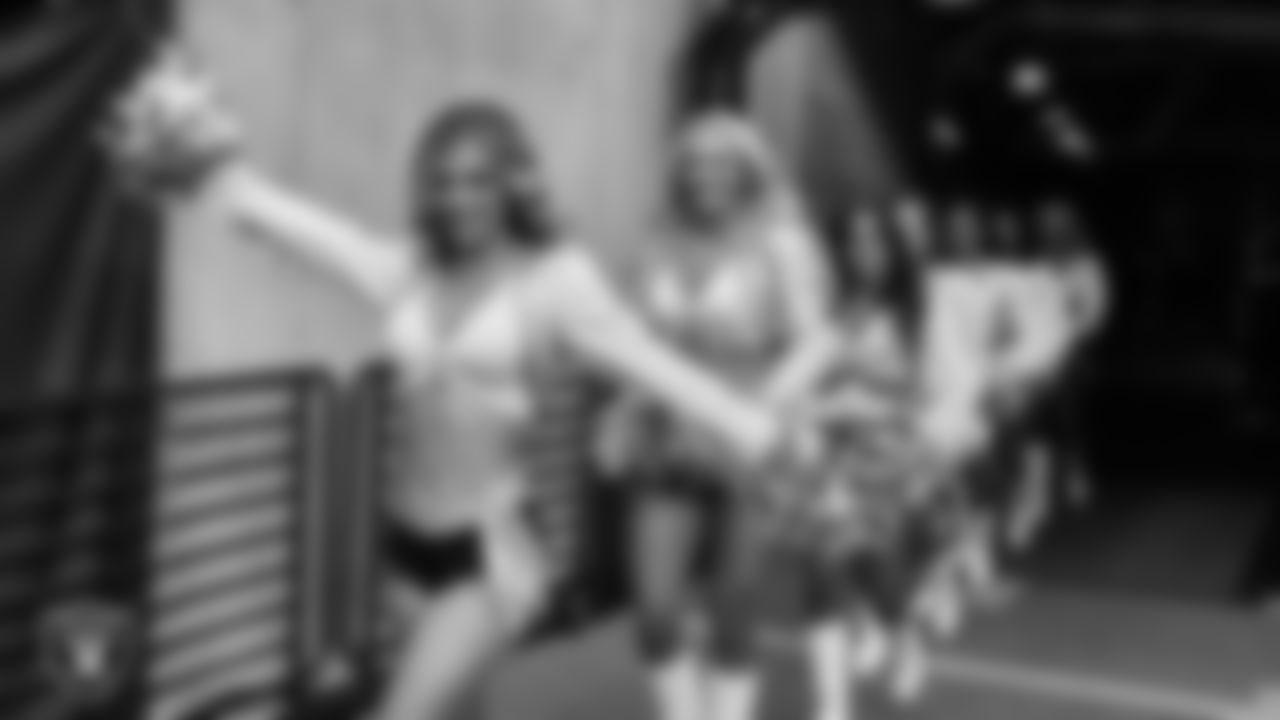 Raiderette Taylor walks through the tunnel before the regular season home game against the Denver Broncos at Allegiant Stadium.