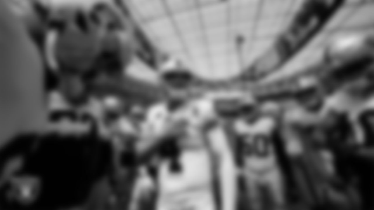Las Vegas Raiders quarterback Derek Carr (4) fires up the the team in a huddle during warm ups before the regular season away game against the Los Angeles Chargers at SoFi Stadium.