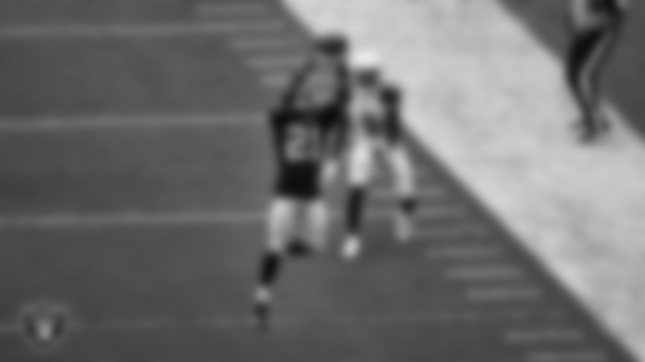 Las Vegas Raiders cornerback Amik Robertson (21) intercepts a pass during the regular season home game against the Arizona Cardinals at Allegiant Stadium.