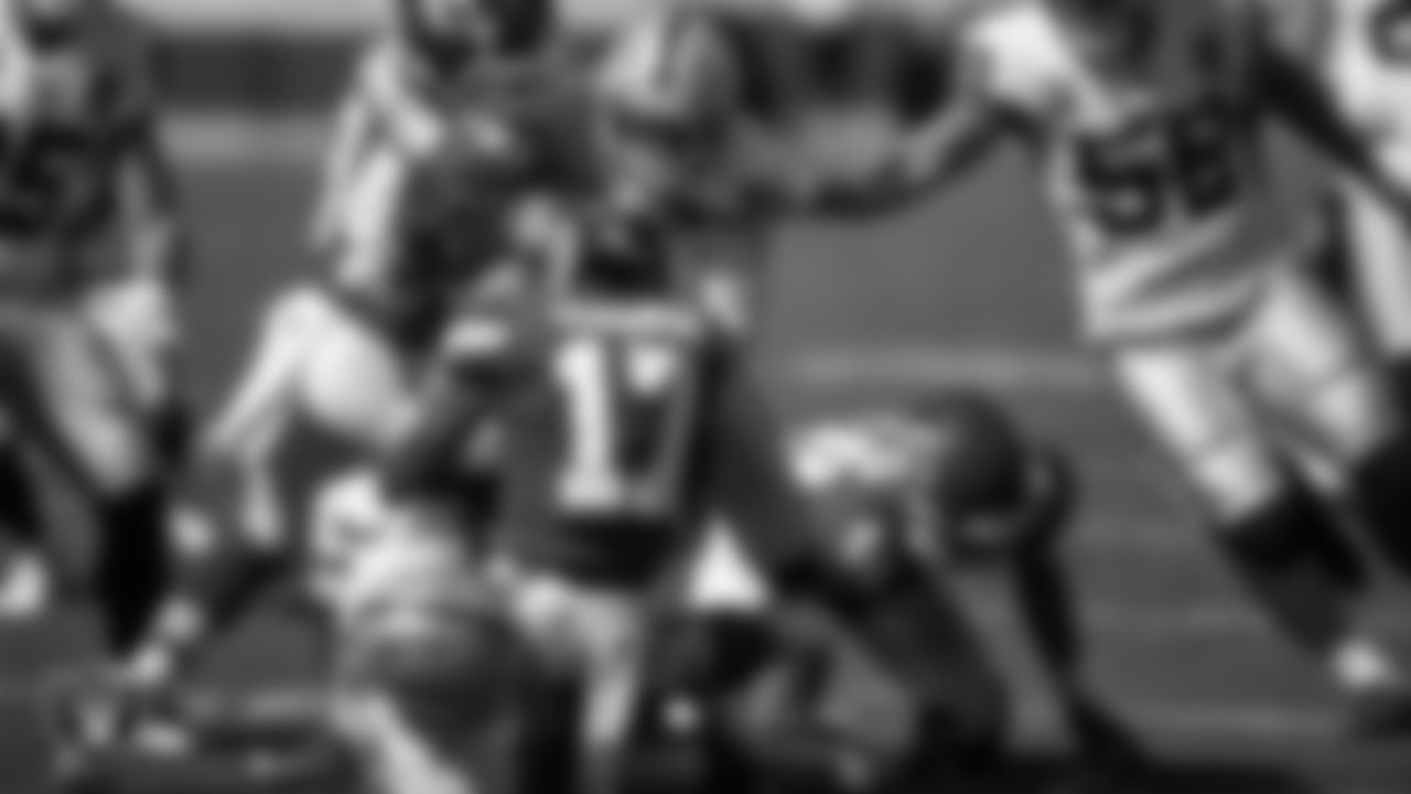 Las Vegas Raiders linebacker Raekwon McMillan (54) and safety Jeff Heath (38) make a tackle during the regular season away game against the Kansas City Chiefs.