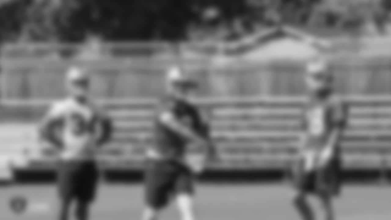 Oakland Raiders running back Chris Warren (34), quarterback EJ Manuel (3), and quarterback Connor Cook (18) on the field for practice at 2018 Pre-Training Camp at The Oakland Raiders Napa Valley Training Complex, Wednesday, July 25, 2018, in Napa, California.