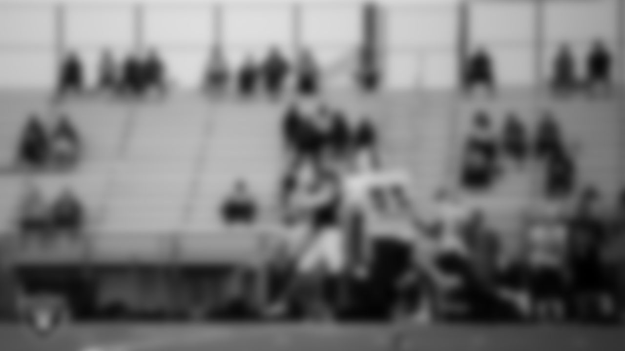 A member of the Spring Valley High School football team makes a catch during the game.