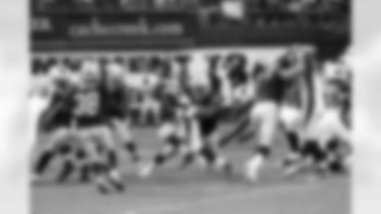 DT John Henderson brings down the Cardinals ball carrier.
