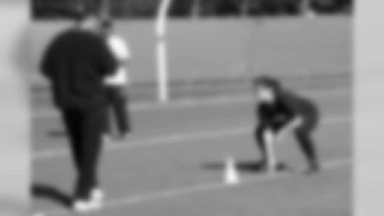 Strength and conditioning coach Brad Roll leads a guest through the 3-cone drill. Photo by Rebecca Corman.