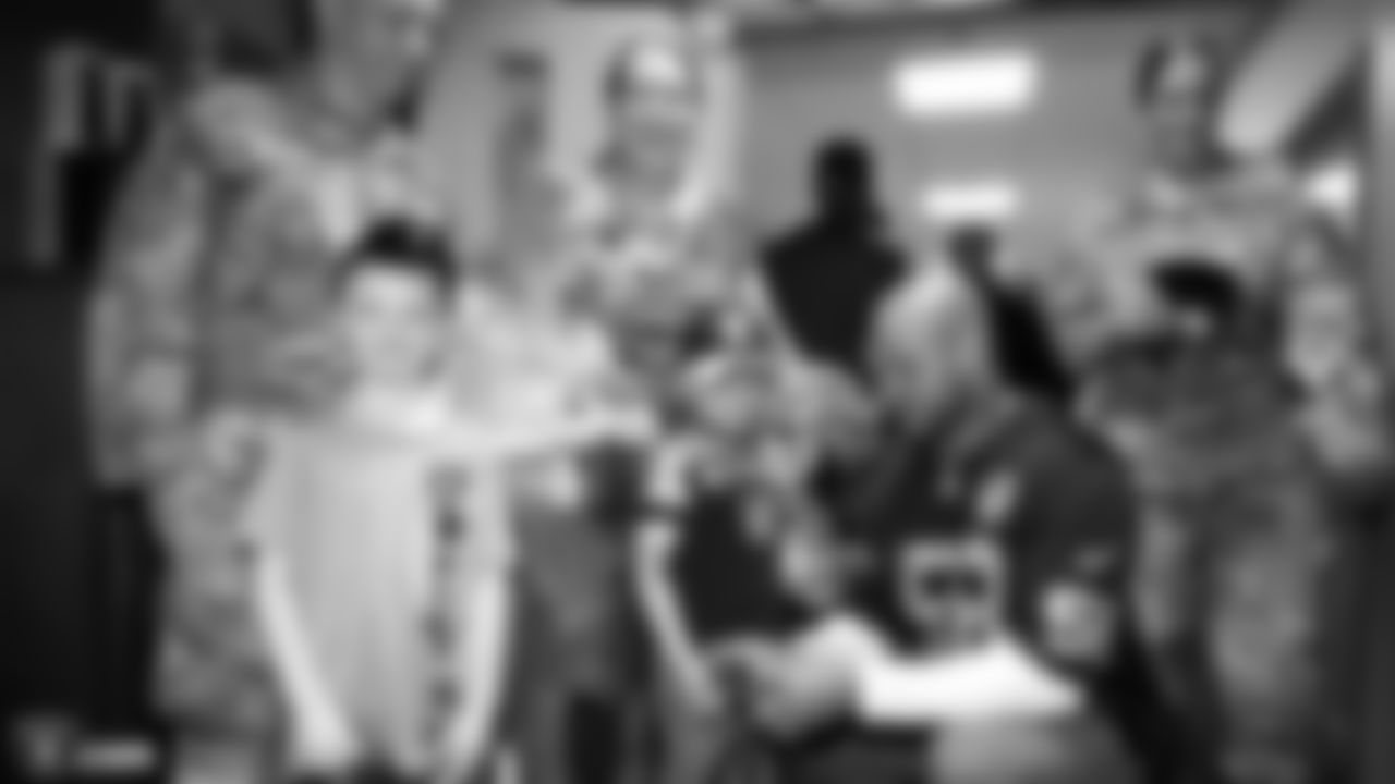 Raiders linebacker Kyle Wilber (58) visits U.S. servicemen and women at Royal Air Force Mildenhall.