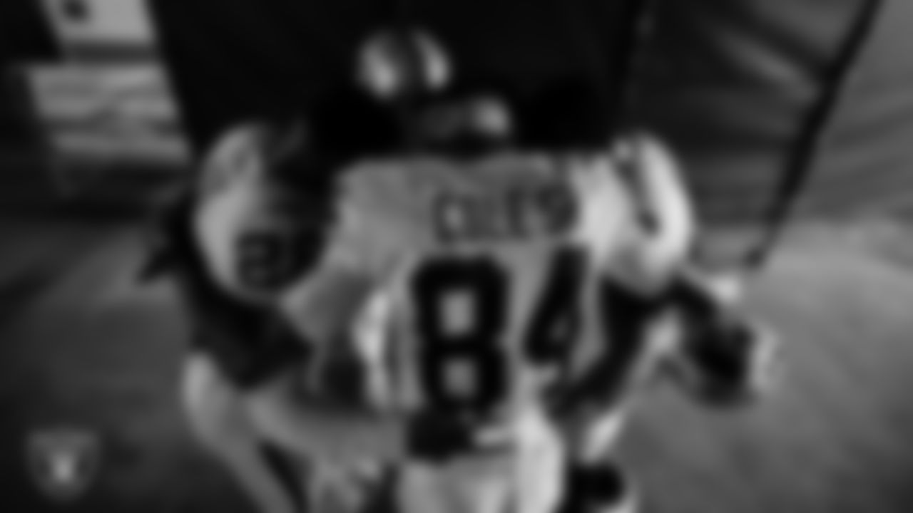 The Las Vegas Raiders returners huddle in the tunnel before the regular season away game against the Denver Broncos at Empower Field at Mile High.