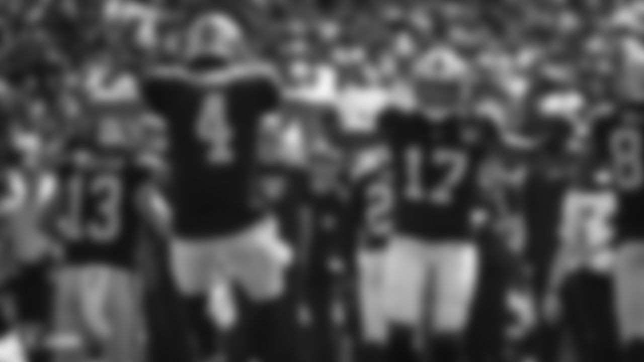 Raiders quarterback Derek Carr (4) and wide receiver/return specialist Dwayne Harris (17) celebrate after a touchdown during the Raiders regular season game against the Kansas City Chiefs.