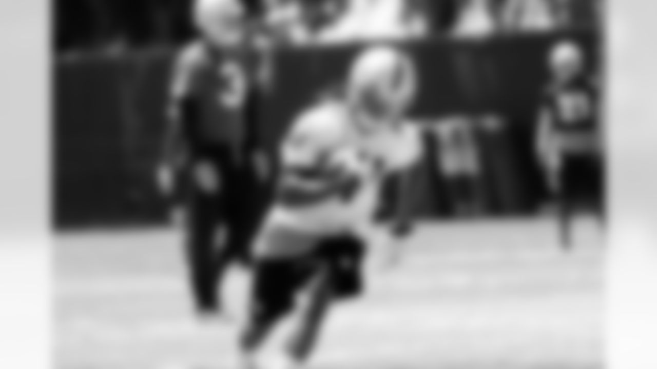WR Denarius Moore runs after the catch.