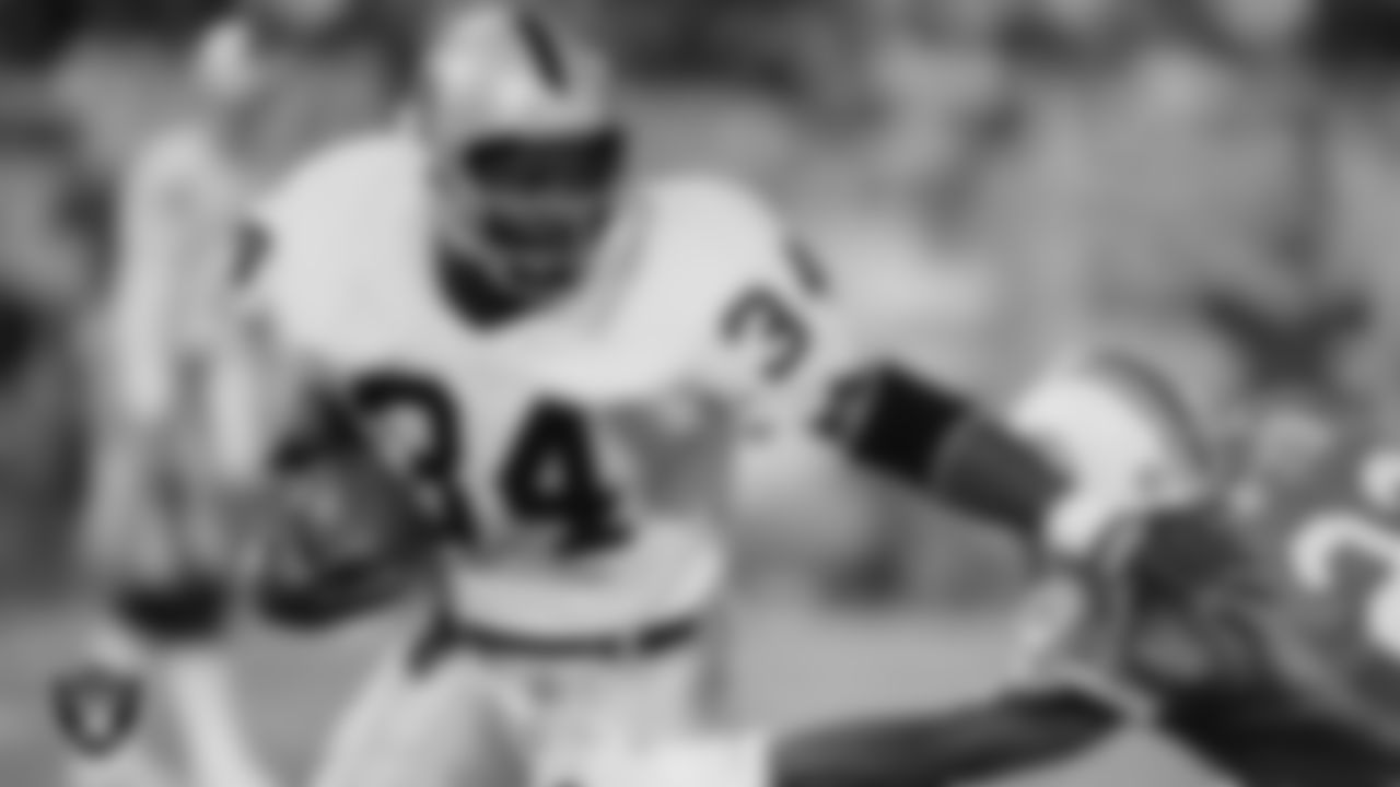 Raiders running back Bo Jackson (34) rushes during the regular season away game against the Miami Dolphins at Joe Robbie Stadium, Monday, November 19, 1990, in Miami Gardens, Fla.