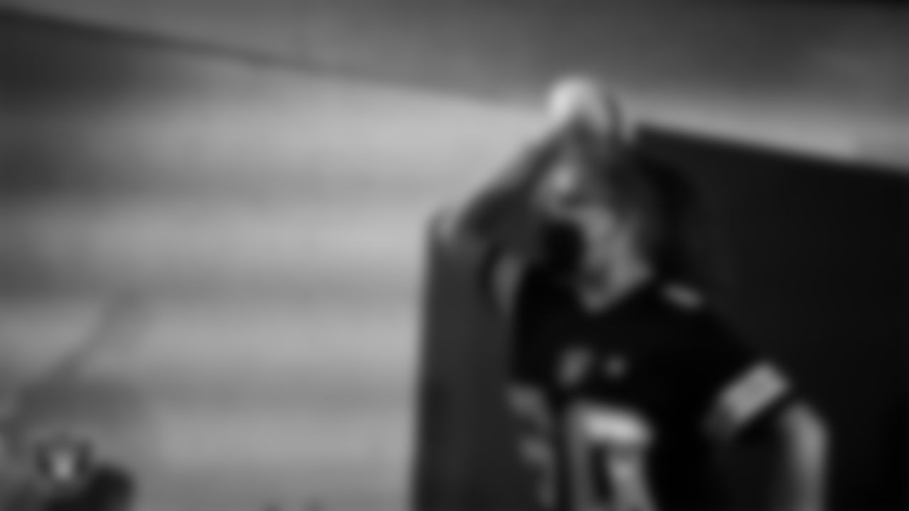 A Las Vegas Raiders fan goes through a drill during the Raider Nation Fan Fest 2022.