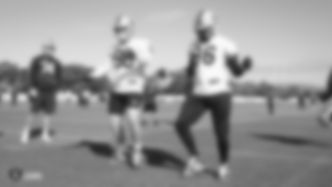 Raiders defensive end Maxx Crosby (98) and defensive end Clelin Ferrell (96) dance during practice.
