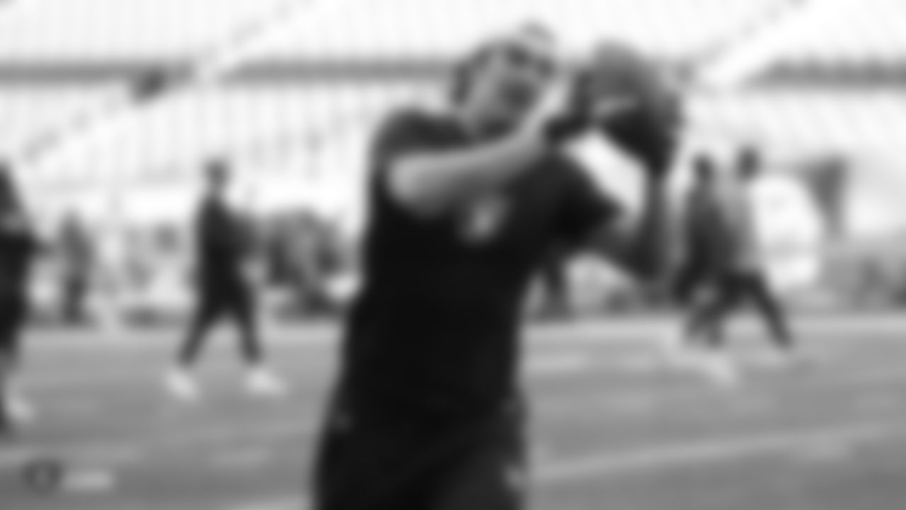 The Raiders warm up before their preseason game against the Green Bay Packers at IG Field.