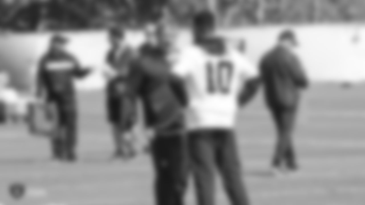 Raiders head coach Jon Gruden and wide receiver Rico Gafford (10) at a workout during phase two of the offseason program at the Raiders Practice Facility in Alameda, Calif.
