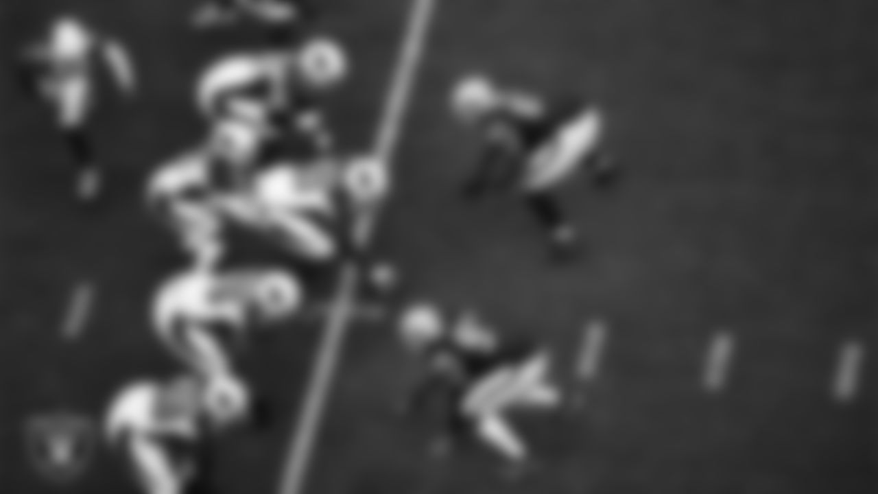 Las Vegas Raiders defensive end Kendal Vickers (95) and defensive tackle Johnathan Hankins (90) lines up before the snap during the regular season home game against the Arizona Cardinals at Allegiant Stadium.