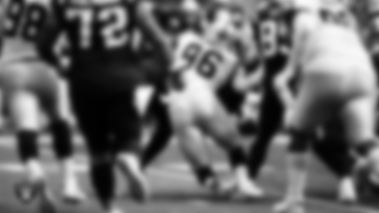 Las Vegas Raiders defensive end Clelin Ferrell (96) makes a tackle during the regular season away game against the New England Patriots.