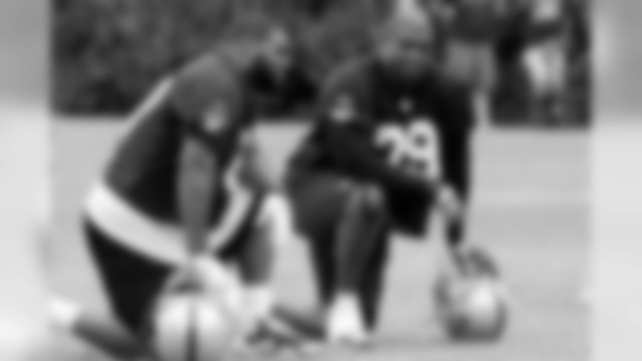 DT John Henderson and DT Kellen Heard take in between drills. Photo By Tony Gonzales