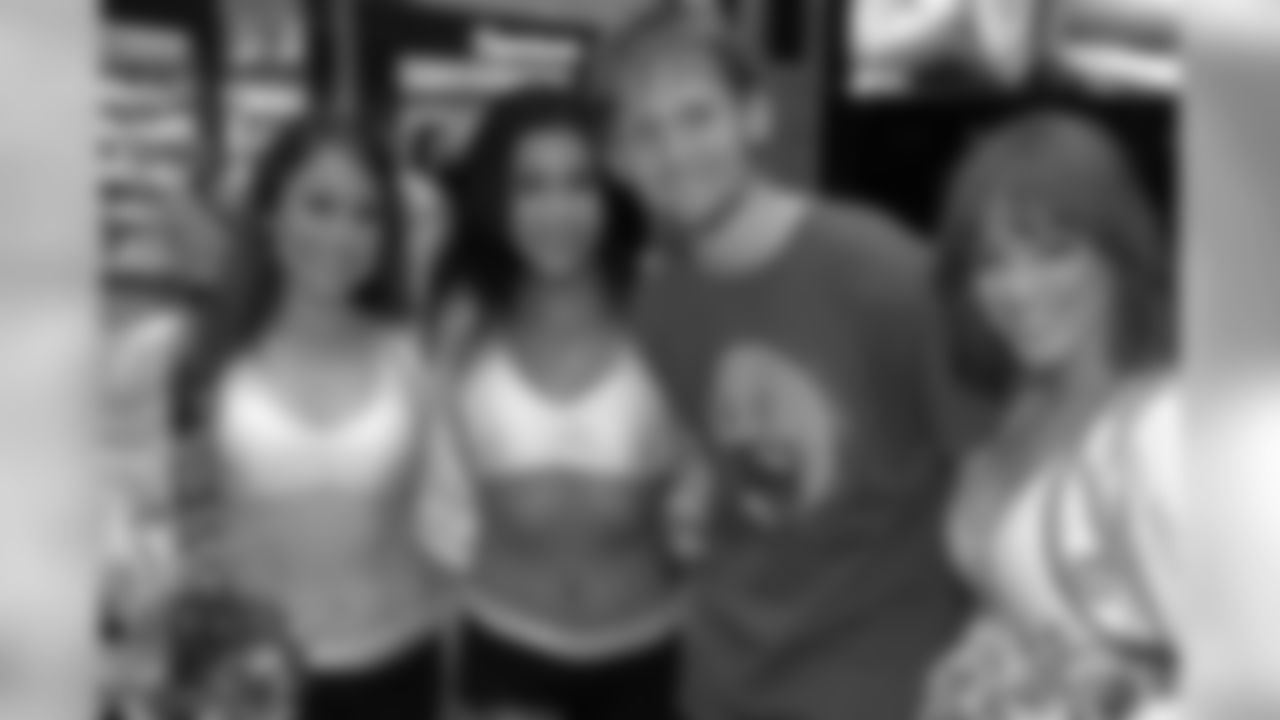 Raiderettes Jennifer, Natalie and Angel pose for a photo with a fan at the DEZ Mall in Innsbruck, Austria. Photo by Roland Faistenberger.