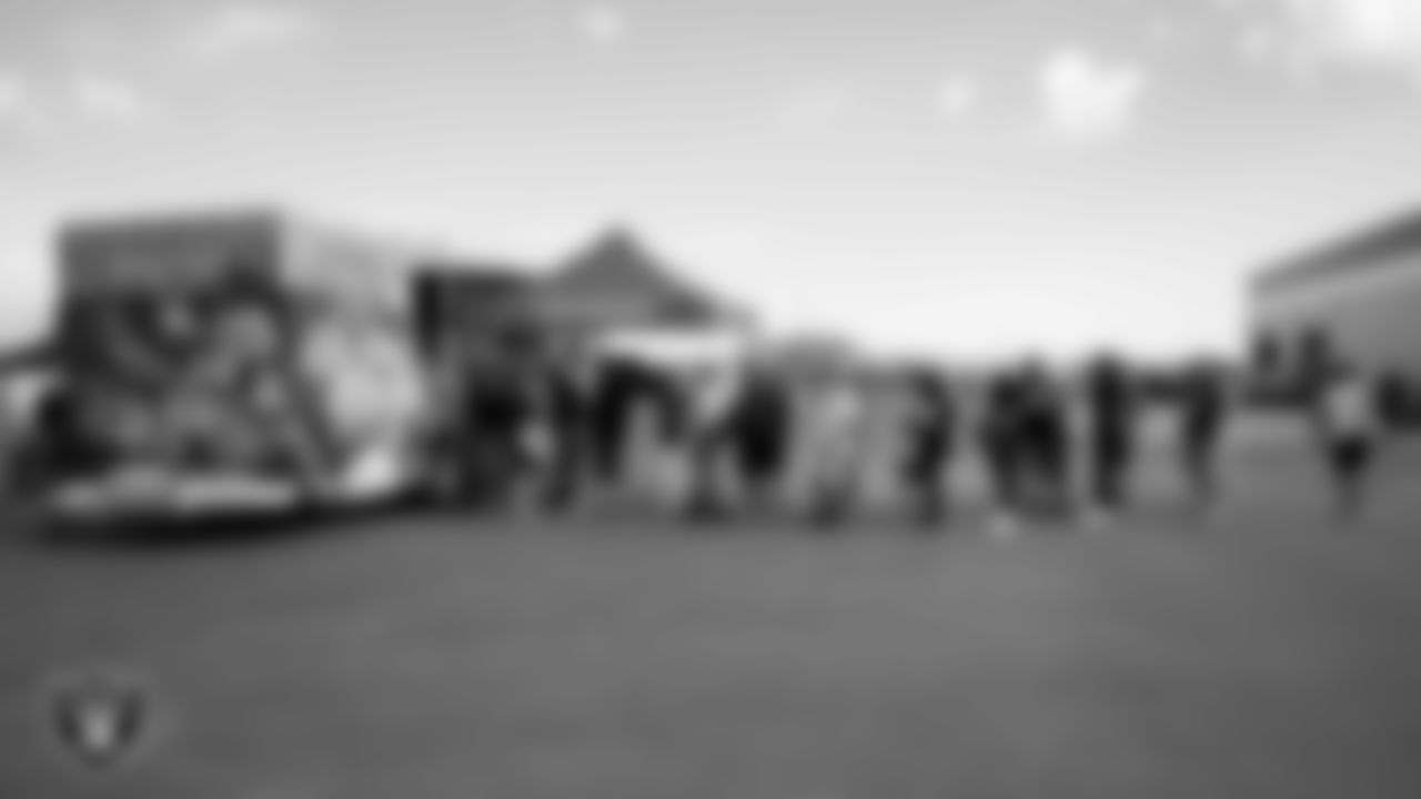 Las Vegas Raiders fans line up for Pinkbox Doughnuts before practice at 2023 Training Camp at Intermountain Health Performance Center.