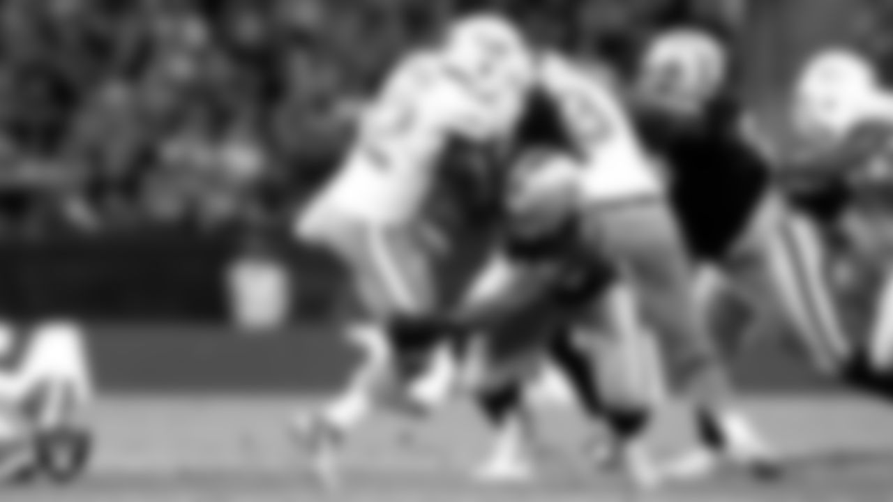 Raiders linebacker Bojay Filimoeatu (54) makes a tackle during the regular season home game against the Miami Dolphins at Wembley Stadium, Sunday, September 28, 2014, in London, England.