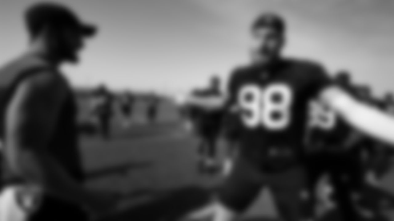 Las Vegas Raiders quarterback Derek Carr (4) and defensive end Maxx Crosby (98) at a workout during phase two of the offseason program.