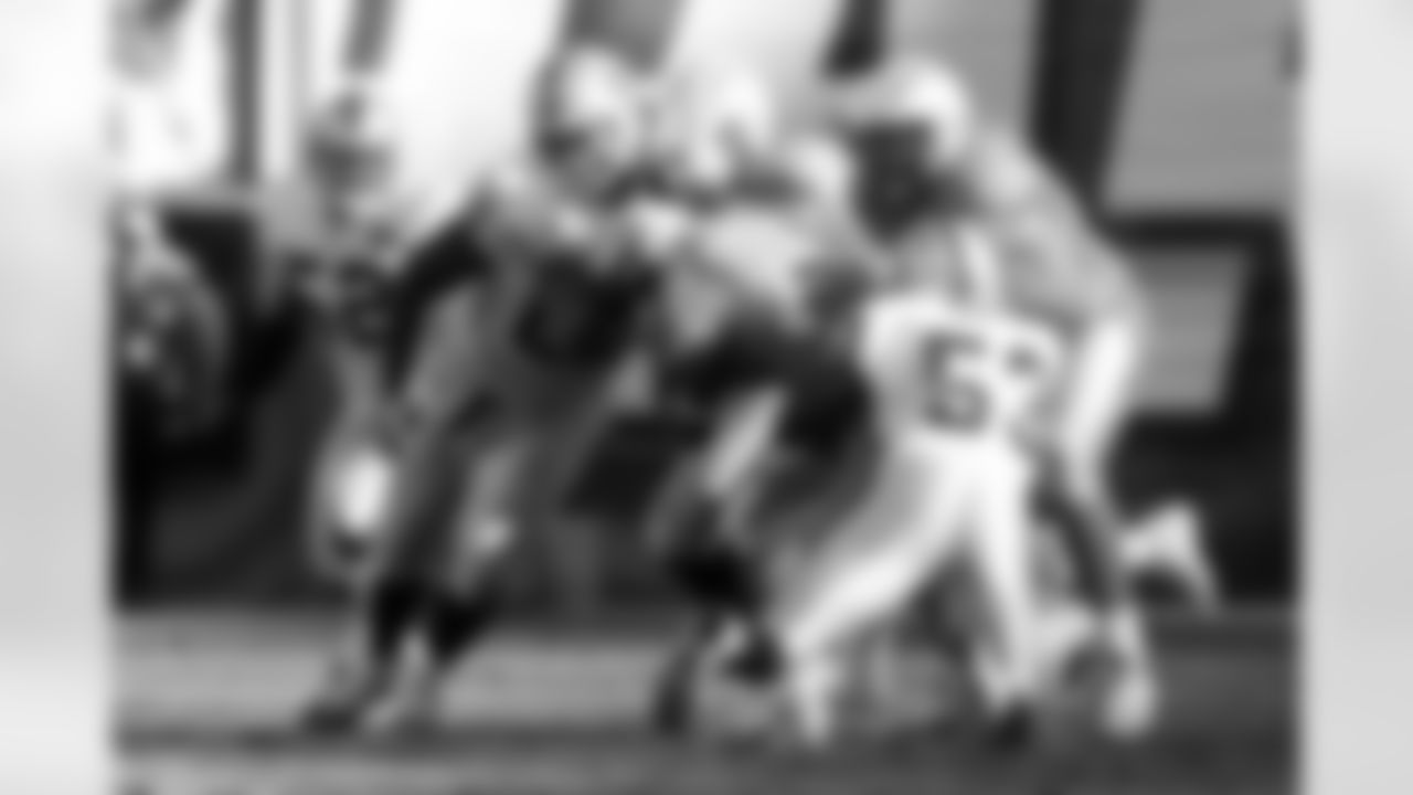 The Raiders defense bottles up RB LaDainian Tomlinson
