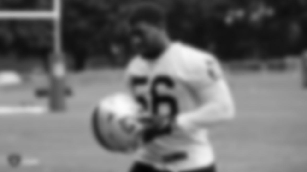 Raiders linebacker Justin Phillips (56) stands on the field during practice.