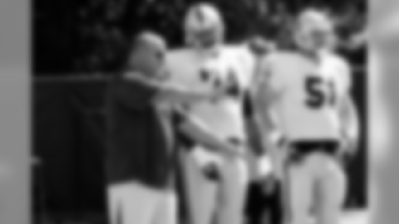 Head Coach Tom Cable offers some instruction. Photo by Tony Gonzales.