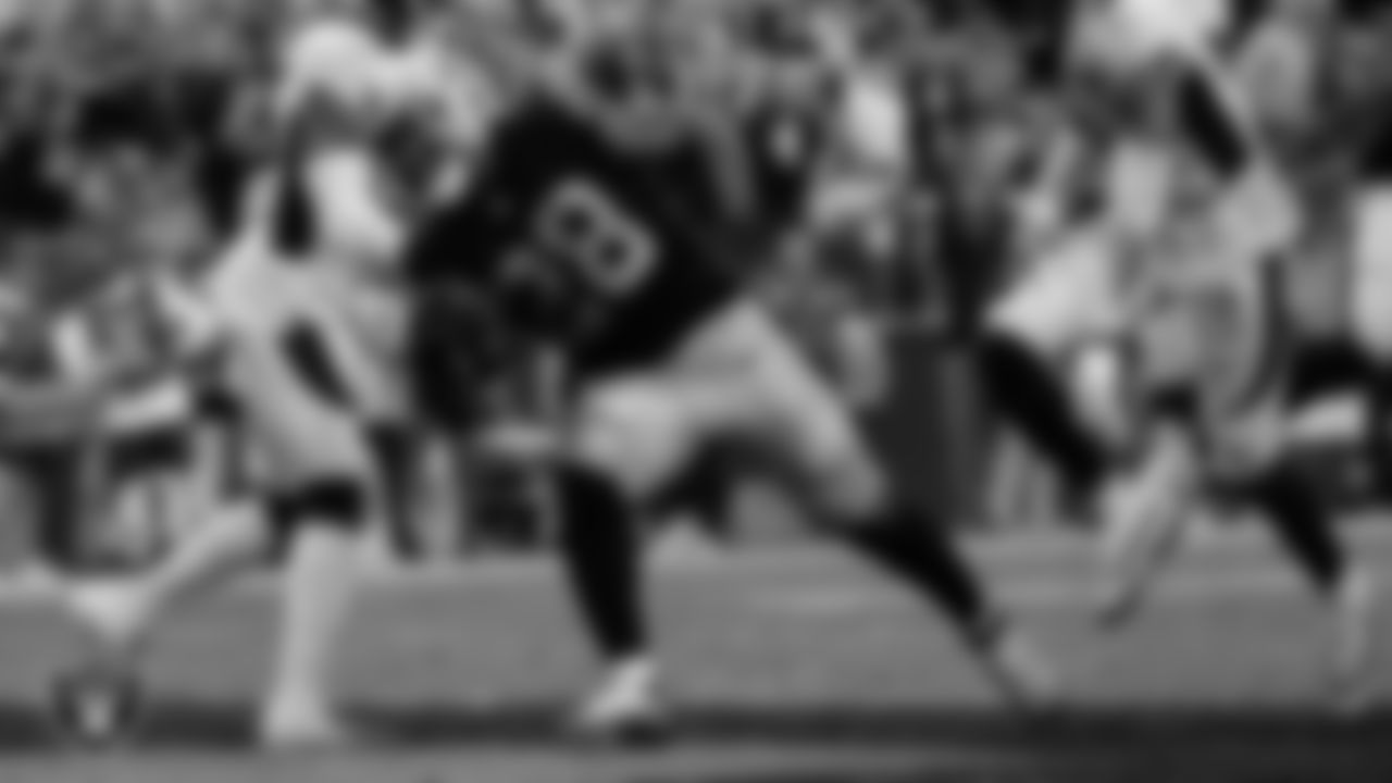 Las Vegas Raiders running back Josh Jacobs (28) rushes for a 7-yard touchdown during the regular season home game against the Denver Broncos at Allegiant Stadium.