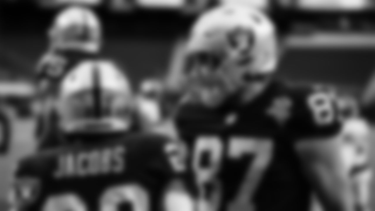 Las Vegas Raiders running back Josh Jacobs (28) celebrates with tight end Foster Moreau (87) after rushing for an 11-yard touchdown during the regular season home game against the Denver Broncos.