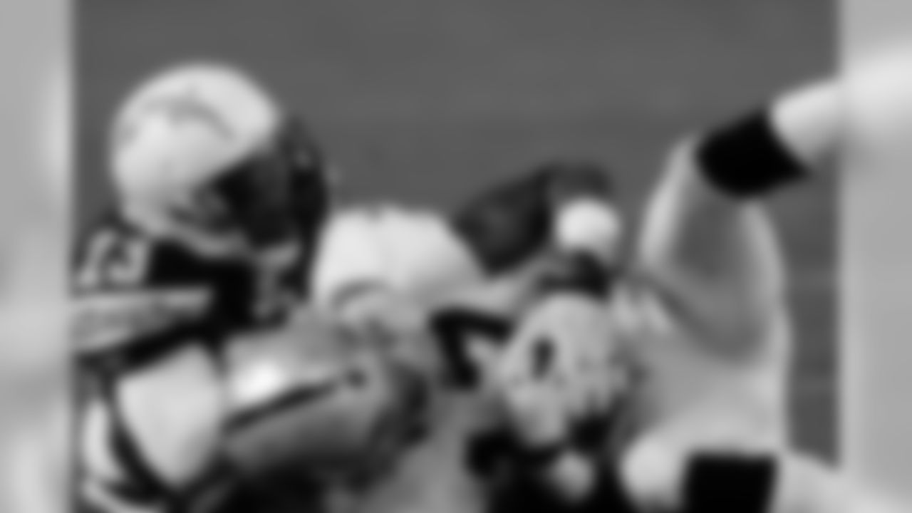 WR Denarius secures the ball for the 46-yard catch.