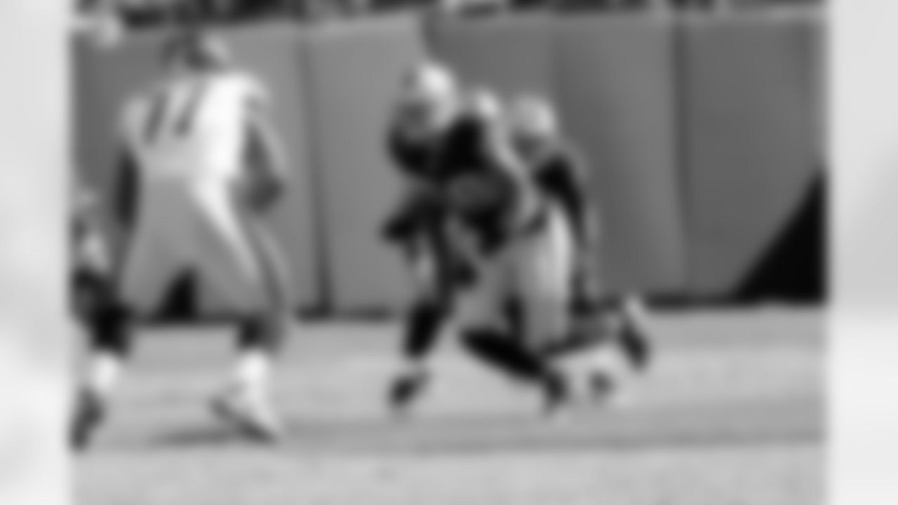 DE Dave Tollefson takes on the offensive lineman.