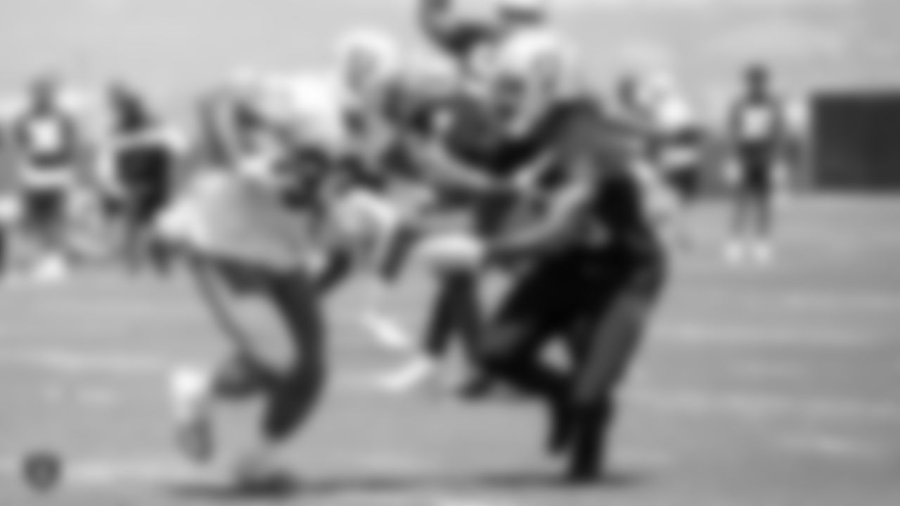 Raiders running back DeAndré Washington (33) and cornerback Nick Nelson (23) at a Mandatory Minicamp at the Raiders Practice Facility in Alameda, Calif.