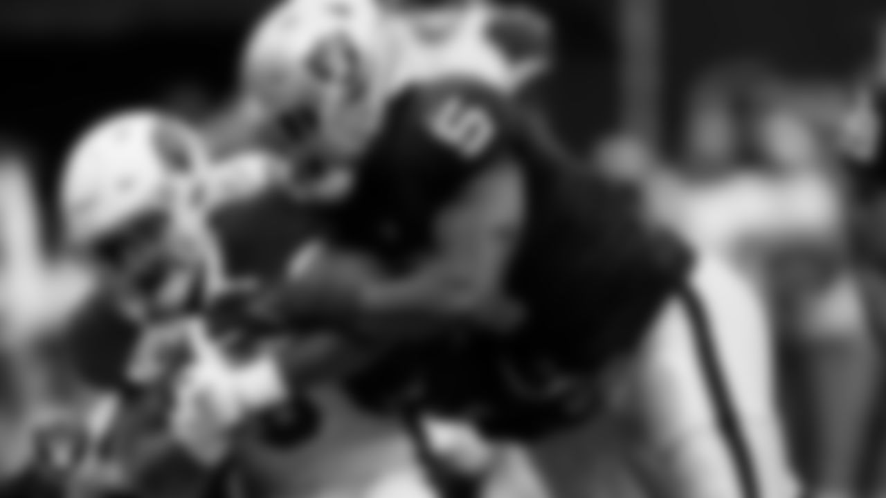 Las Vegas Raiders linebacker Divine Deablo (5) makes a tackle during the regular season home game against the Arizona Cardinals at Allegiant Stadium.