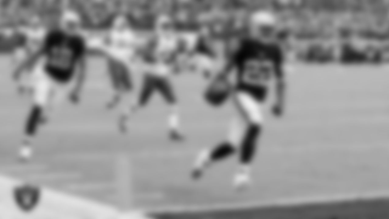 Raiders running back/defensive back Taiwan Jones (22) heads to the end zone on a 59-yard touchdown catch during the regular season home game against the New York Jets at O.co Coliseum, Sunday, November 1, 2015, in Oakland, Calif.