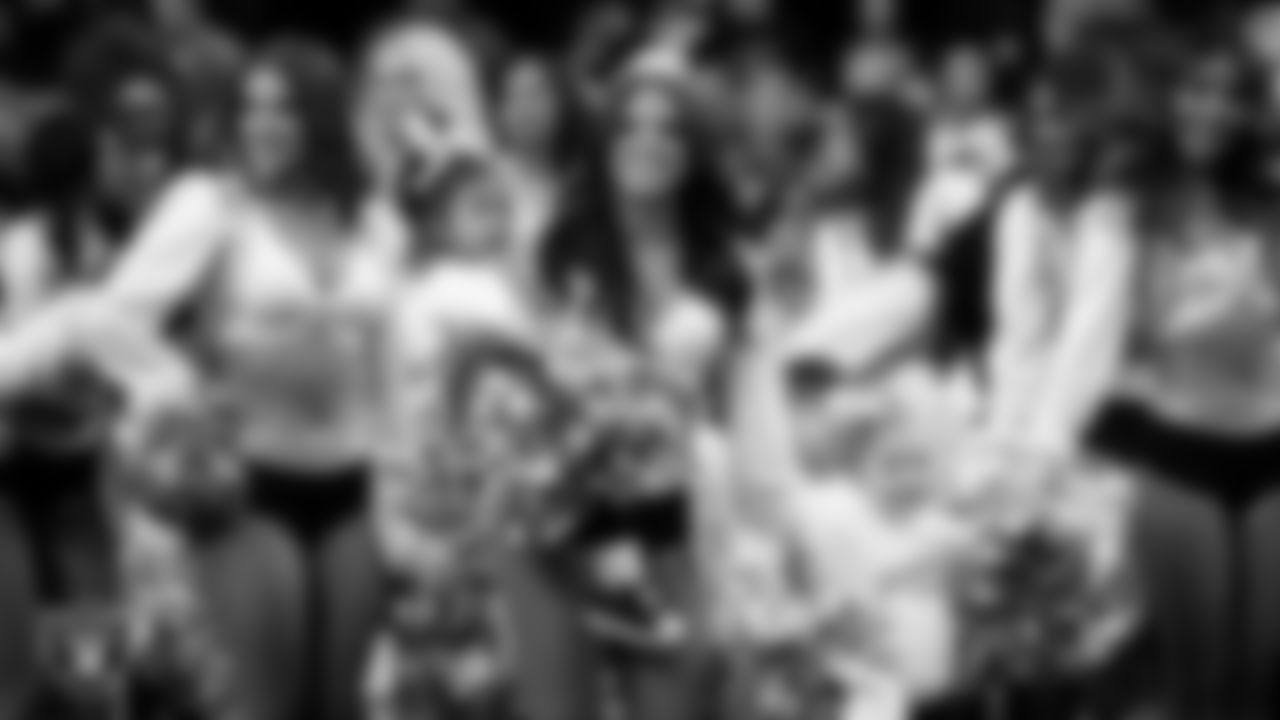 Raiderette Audrey and Junior Raiderettes wait to take the field for a performance before the regular season home game against the Los Angeles Chargers at Allegiant Stadium.