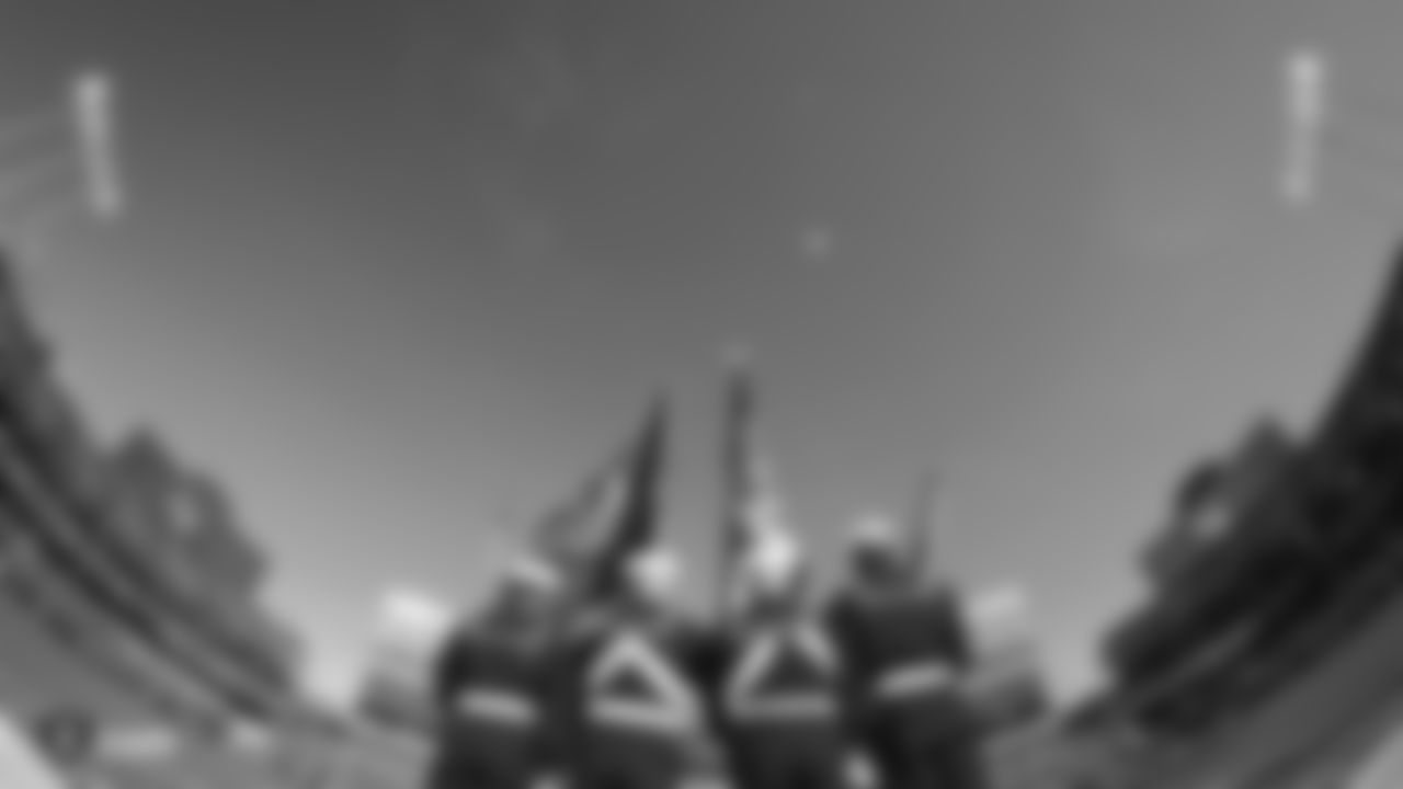 Members of the military present the nation's colors during the national anthem before the Raiders regular season game against the Cincinnati Bengals.