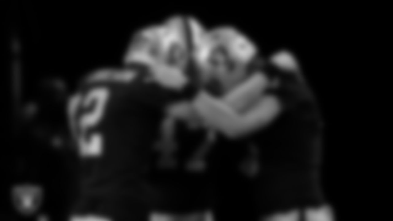 The Las Vegas Raiders special teams unit huddles in the tunnel before the regular season home game against the Los Angeles Chargers.