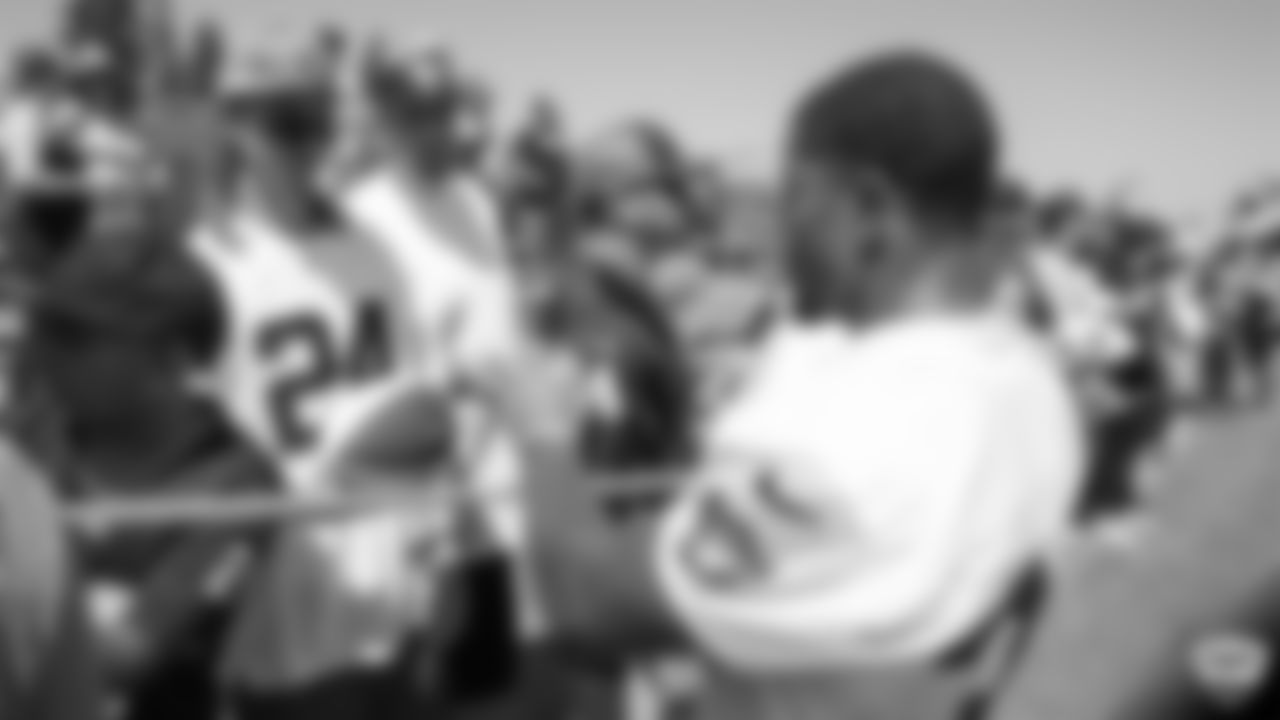 Oakland Raiders running back DeAndré Washington (33) signs autographs for fans after practice at 2019 Training Camp.