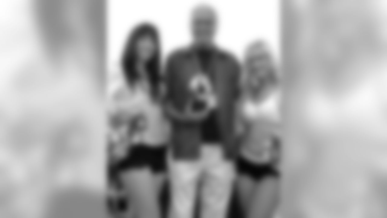 Former state senator and congressman John Burton poses for a photo with the Raiderettes after accepting the Children's Guardian Award. Photo by Tony Gonzales.