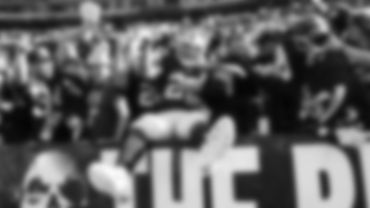 Raiders running back Josh Jacobs (28) celebrates with fans after rushing for 3-yard touchdown during the regular season game against the Detroit Lions.