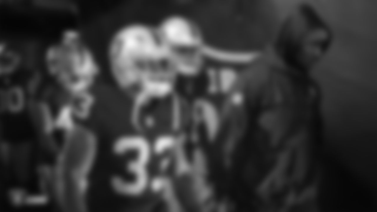 Oakland Raiders running back DeAndrŽ Washington (33) waits to be introduced onto the field before the Oakland Raiders regular season game against the Denver Broncos at Oakland-Alameda County Coliseum, Monday, December 24, 2018, in Oakland, California. The Oakland Raiders won 24-17.