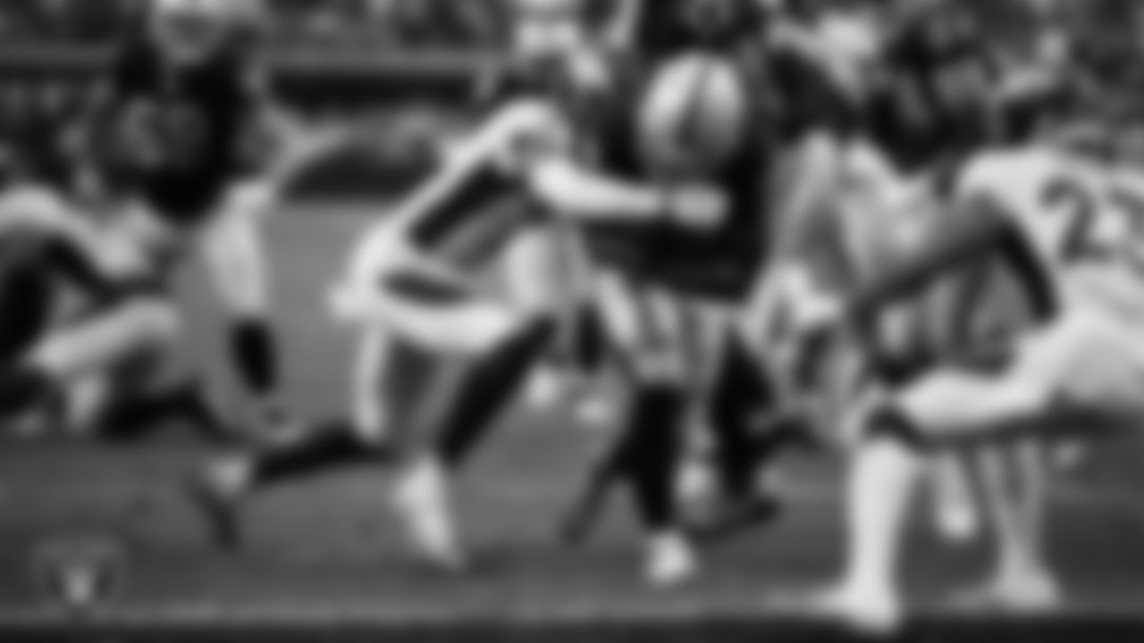 Las Vegas Raiders running back Josh Jacobs (28) rushes for a 7-yard touchdown during the regular season home game against the Denver Broncos at Allegiant Stadium.