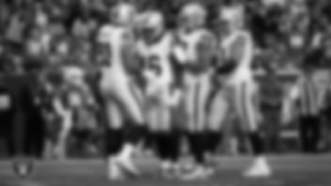 Las Vegas Raiders wide receiver Jakobi Meyers (16) is congratulated by teammates after making a 6-yard touchdown catch during the regular season away game against the Denver Broncos at Empower Field at Mile High.