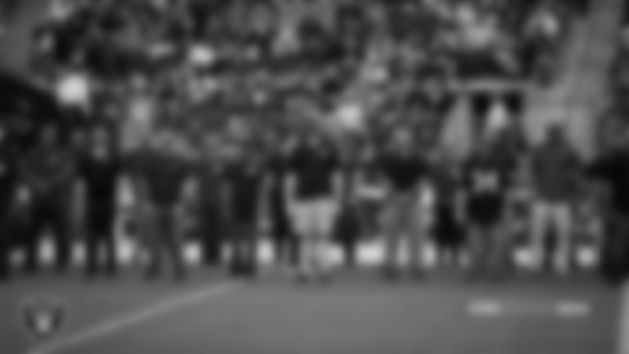 Frontline workers are honored on the field before the Las Vegas Raiders preseason home game against the Seattle Seahawks at Allegiant Stadium.