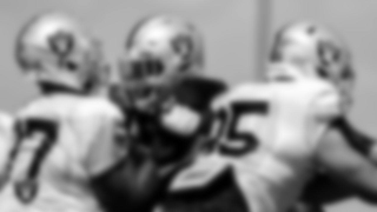 Las Vegas Raiders tackle Thayer Munford Jr. (77) and defensive tackle Matthew Butler (94) during practice at Intermountain Healthcare Performance Center.