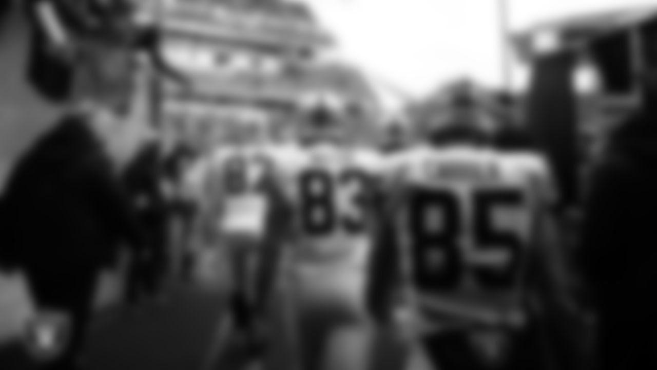 Las Vegas Raiders tight end Darren Waller (83) and tight end Derek Carrier (85) walk down the tunnel before the postseason away game against the Cincinnati Bengals.